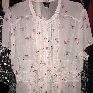 Torrid top with hummingbirds.